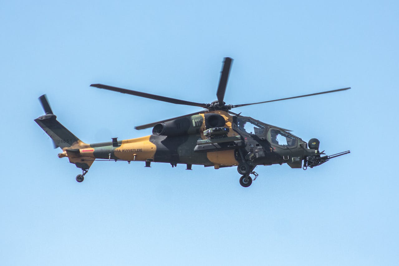 about-us Close-up of a military helicopter flying in clear skies over Adana, Türkiye.